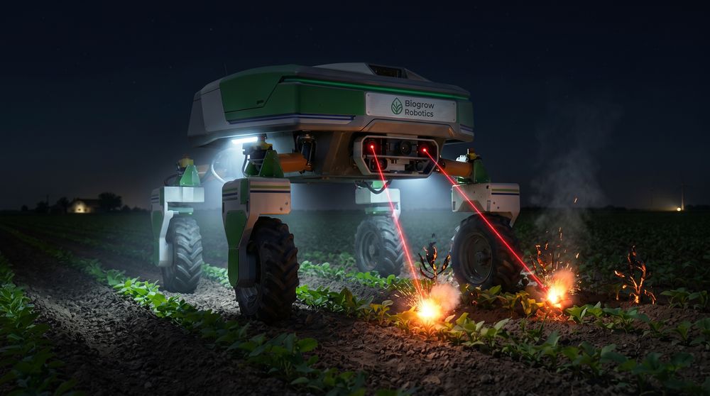 The robot operating at night, lit by its own work lights, firing laser pulses at weeds.